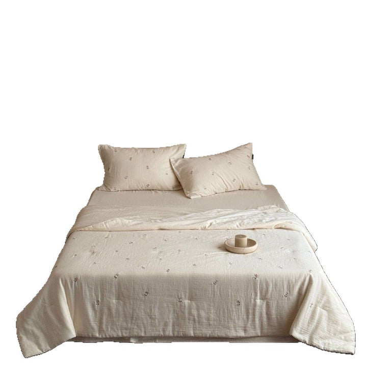 Linen bedding set with subtle floral embroidery