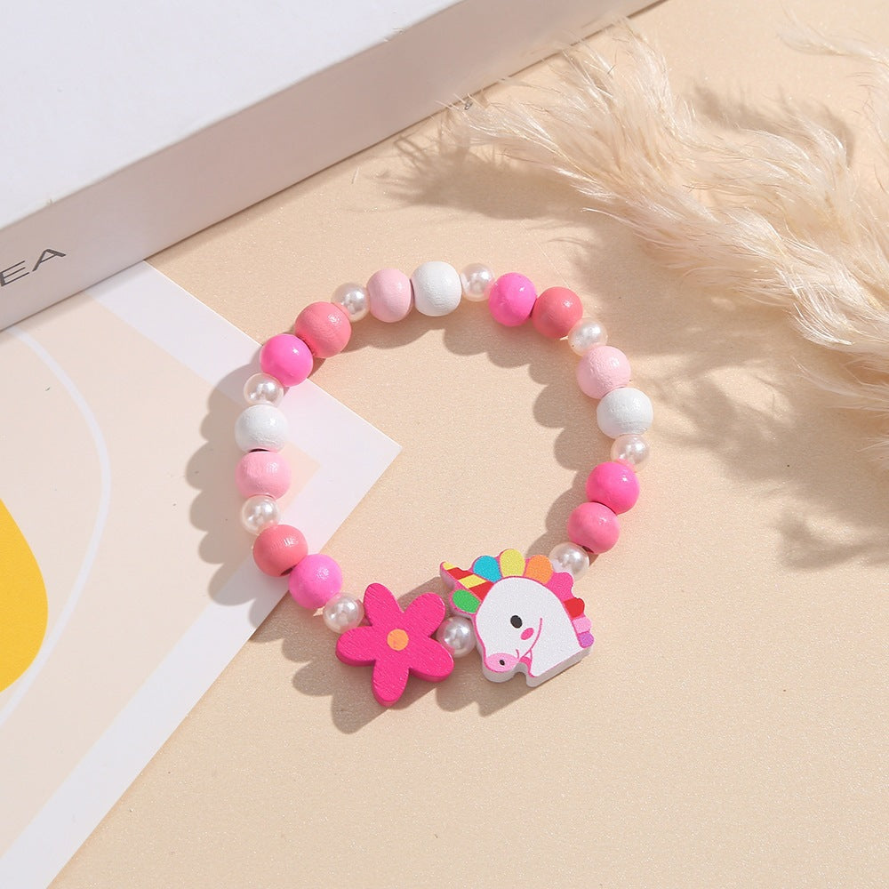 Playful children's bracelet with unicorn and flower motif Bowlift