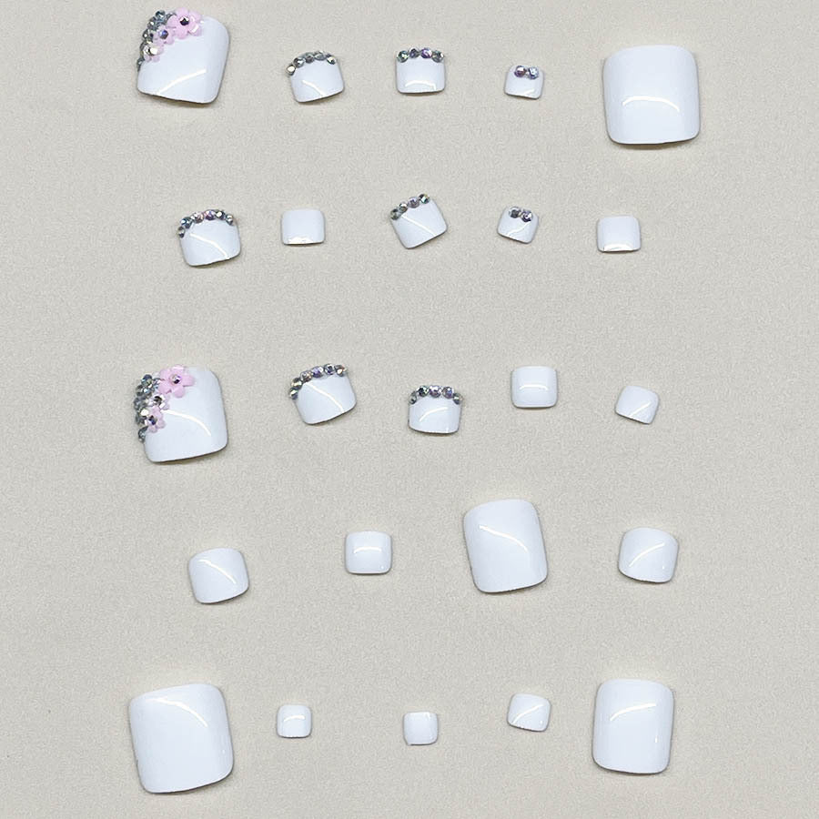 Nail art set with elegant glitter embellishments and floral accents Bowlift