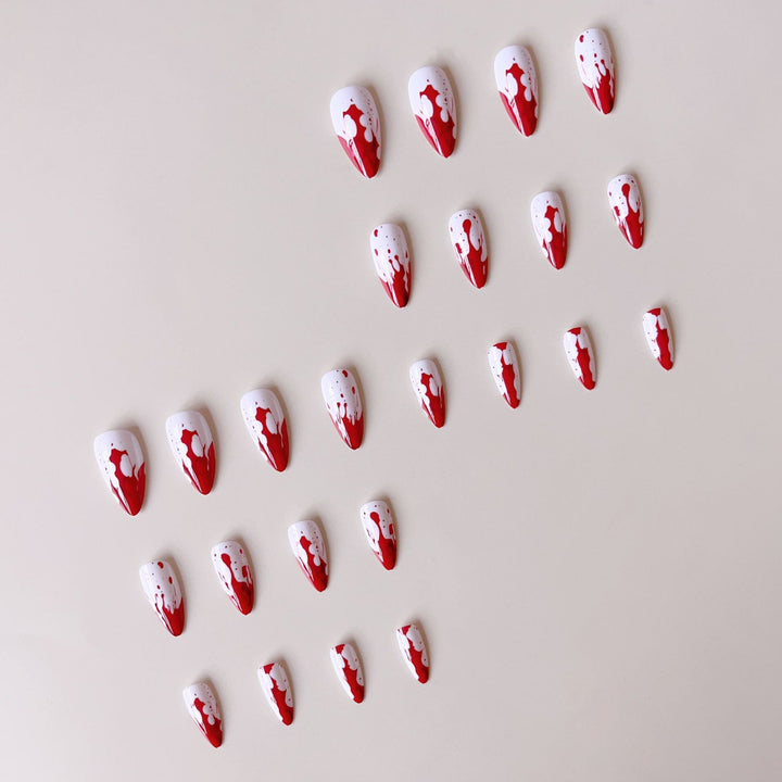 Artificial nail set with blood red inspired design and pointed accents Bowlift