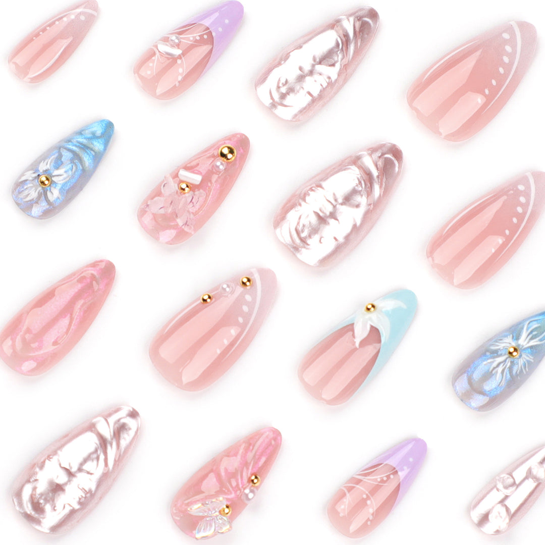 Artistic stiletto nails with delicate flower and glitter embellishments Bowlift