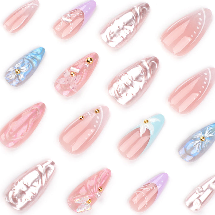 Artistic stiletto nails with delicate flower and glitter embellishments Bowlift