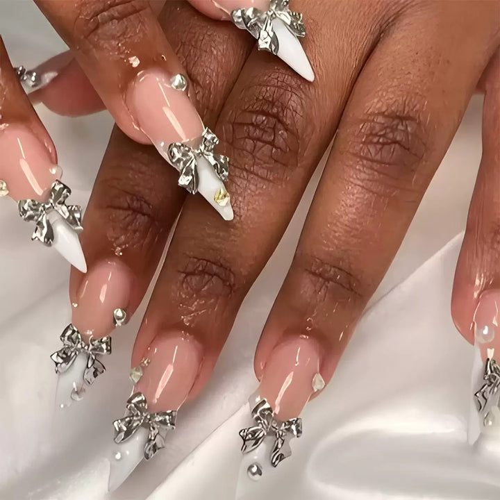 Acrylic nail set with elegant bows and sparkling accents Bowlift