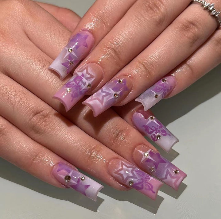 Artistic acrylic nails with modern glitter accents Bowlift