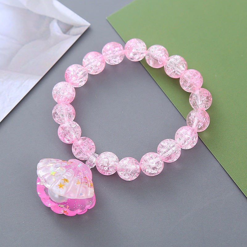 Playful bracelet with shell pendant Bowlift