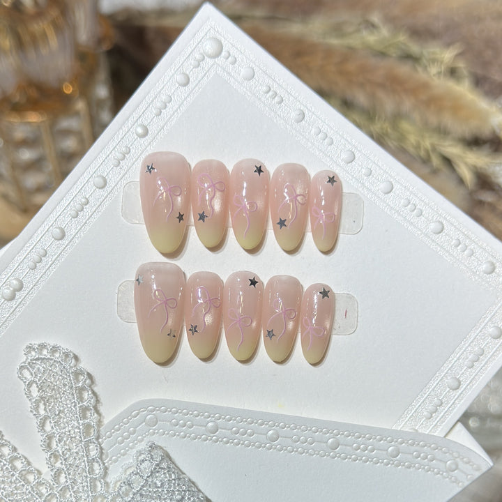 Press-On Nail Set with Bow and Star Accents Bowlift