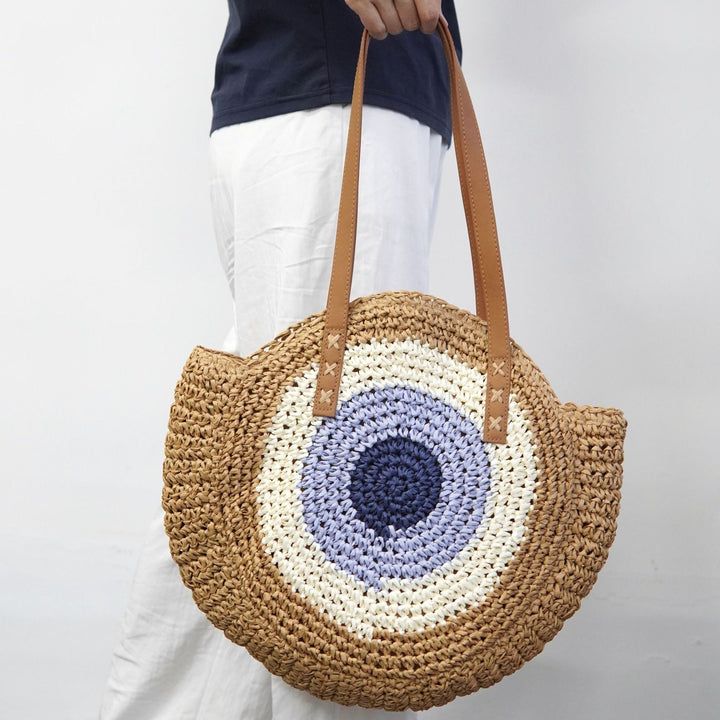 Braided basket bag with unique round design and elegant shoulder straps Bowlift
