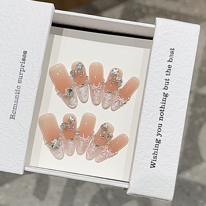 Artificial nails with romantic rhinestone details Bowlift
