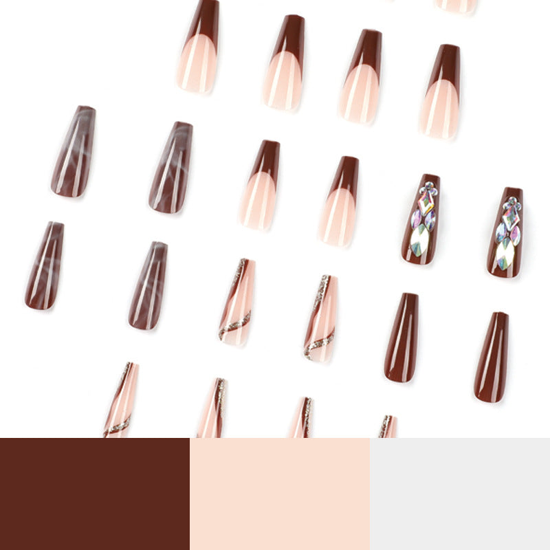 Artificial nail extensions with elegant gemstone embellishments Bowlift
