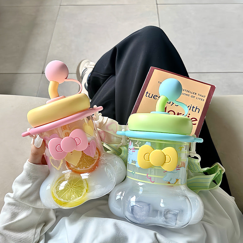 Women's water bottle with integrated silicone carrying handle and playful design Bowlift