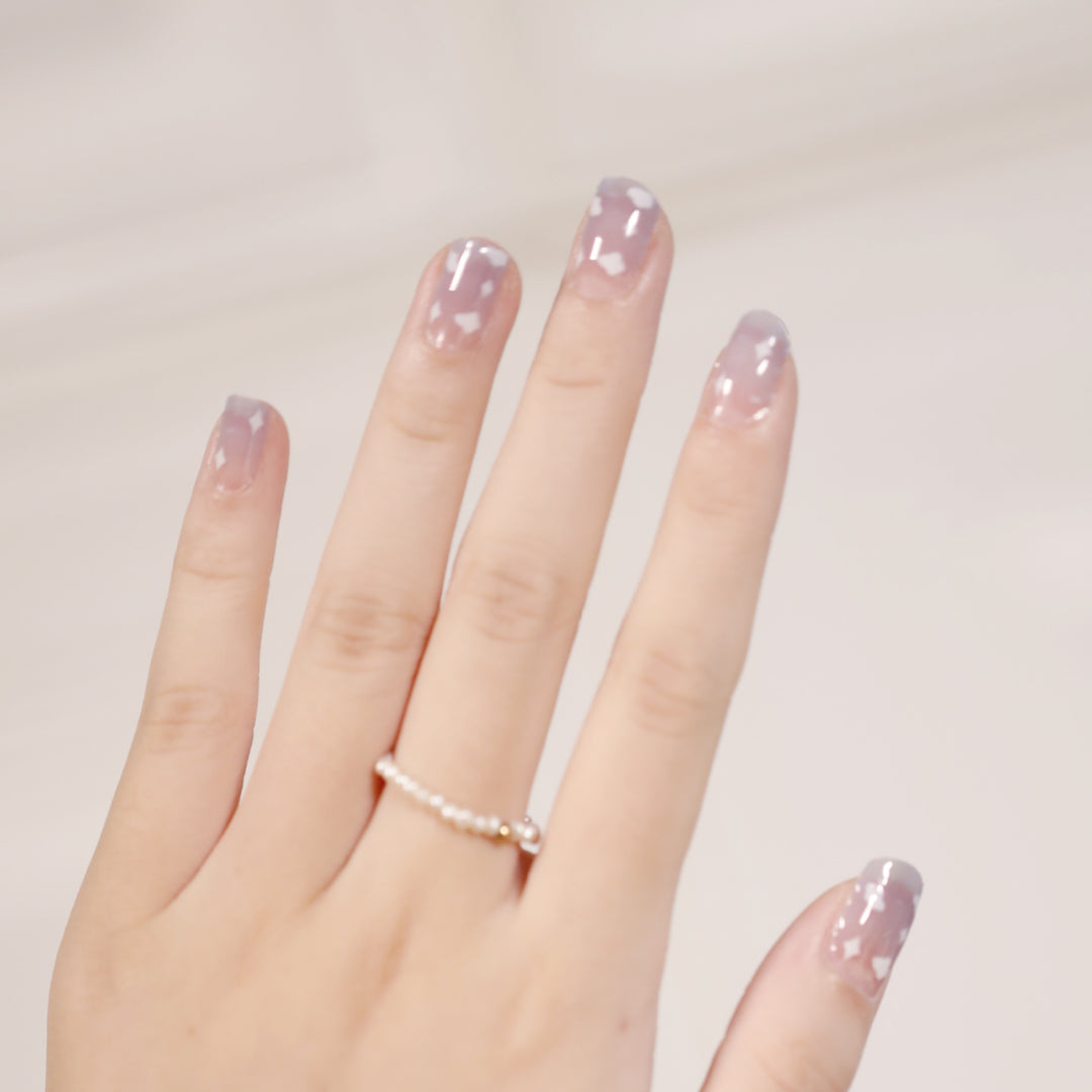 Artificial nail art with heart-shaped designs and soft color gradients Bowlift