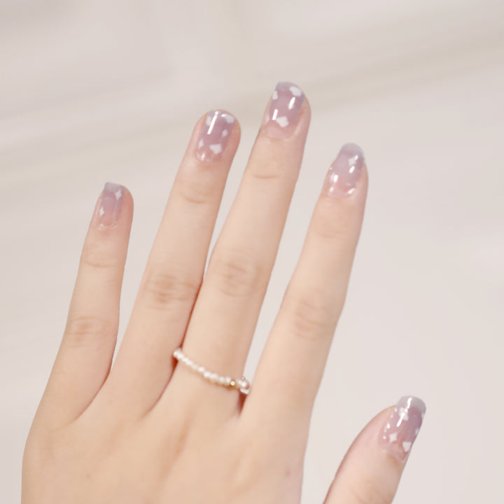 Artificial nail art with heart-shaped designs and soft color gradients Bowlift