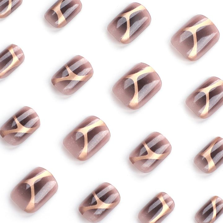 Artificial nail art with elegant metallic design and glitter accents Bowlift