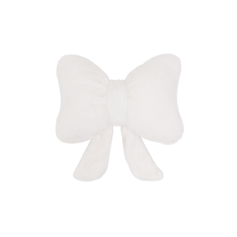 plush bow-shaped decorative throw cushion with long tails and faux-fur texture Bowlift