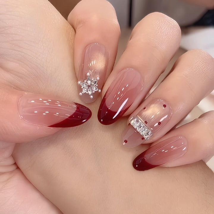 Artificial nails with festive design and rhinestone details Bowlift