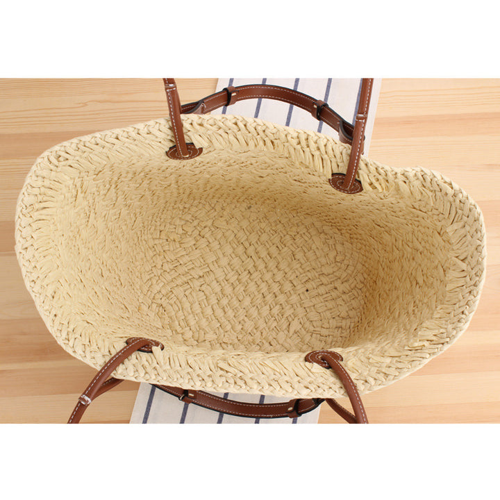 Beach bag made of handcrafted natural material with sturdy leather handle Bowlift