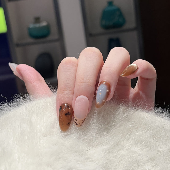 Artistic Press-On Nail Set with Unique Abstract Design Elements Bowlift