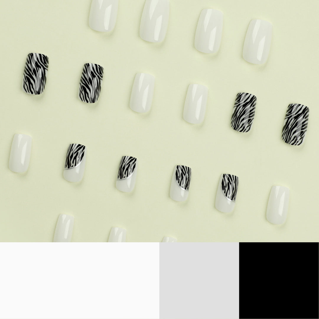 Artful nail extensions with stylish zebra pattern Bowlift
