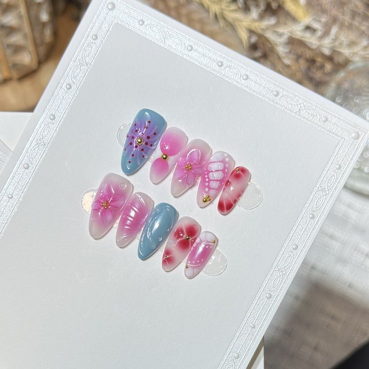 Artistic Press-On Nail Set with Floral and Abstract Designs Bowlift