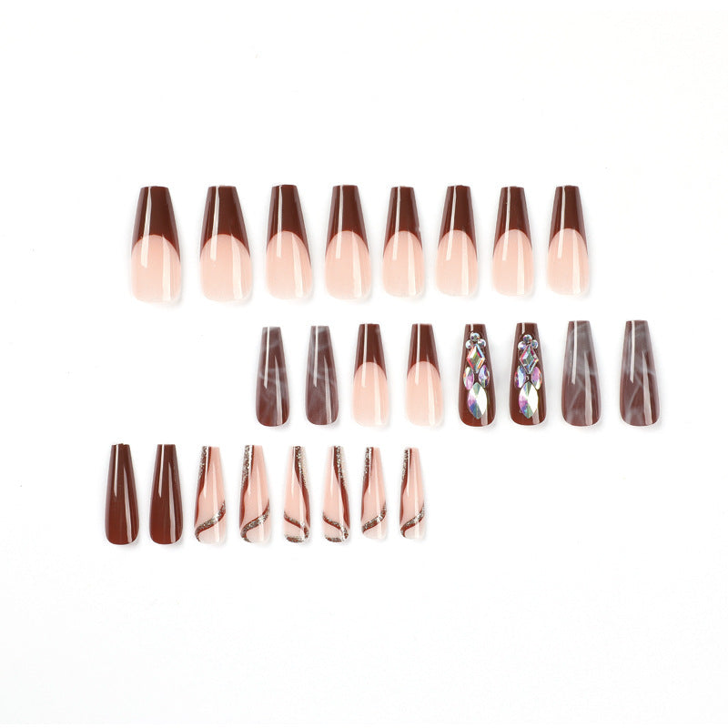 Artificial nail extensions with elegant gemstone embellishments Bowlift
