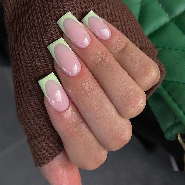 Artistic nail extensions with elegant French tip and modern accents Bowlift