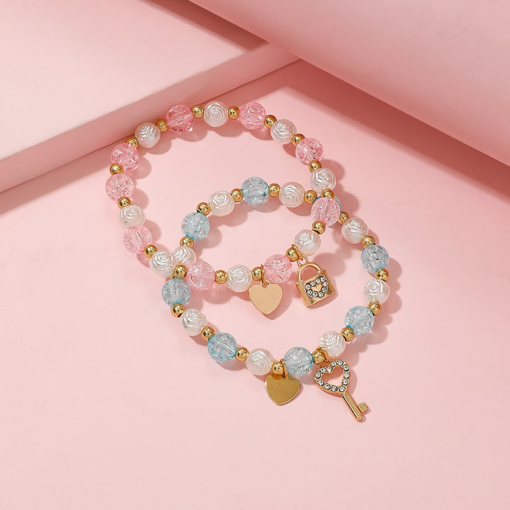 Playful bracelet set with heart and key design Bowlift