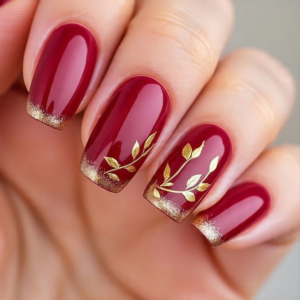 Artificial nails with golden leaf patterns Bowlift
