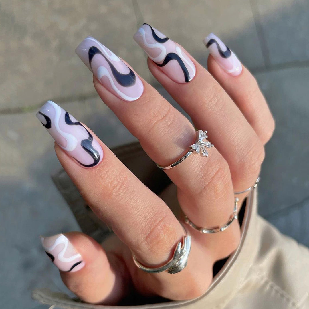 Artful nail extensions with elegant curved patterns Bowlift