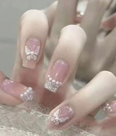 Elegant nail design with pearl embellishment Bowlift