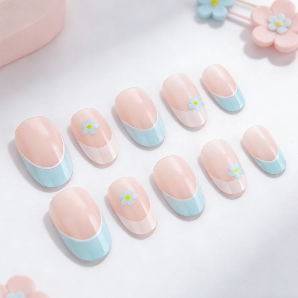 Elegant French Tip Press-On Nails with Floral Accents Bowlift