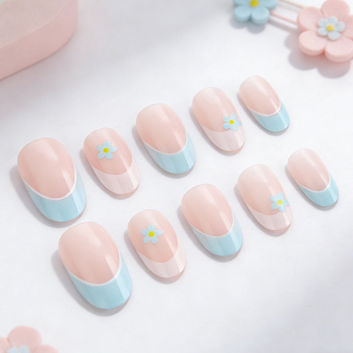 Elegant French Tip Press-On Nails with Floral Accents Bowlift