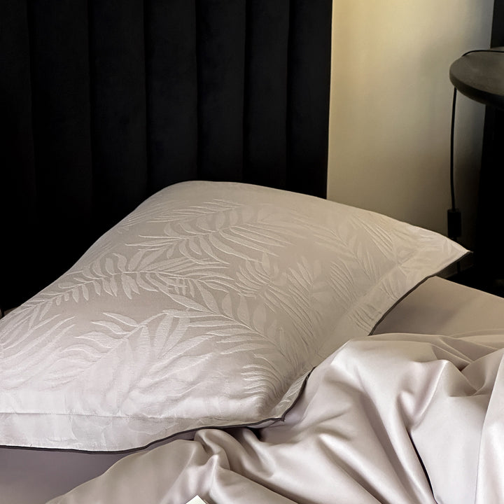 Luxury satin bed linen set with subtle jacquard leaf pattern