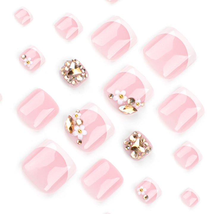 Artistic toenail art with elegant flower and glitter accents Bowlift