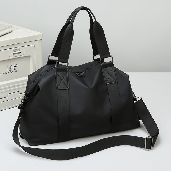 Sporty travel bag with water-repellent properties and ergonomic carrying handles Bowlift