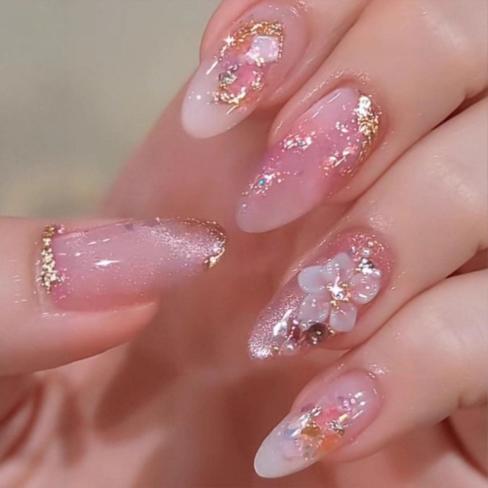 Artificial nails with delicate floral decorations and glitter effects Bowlift