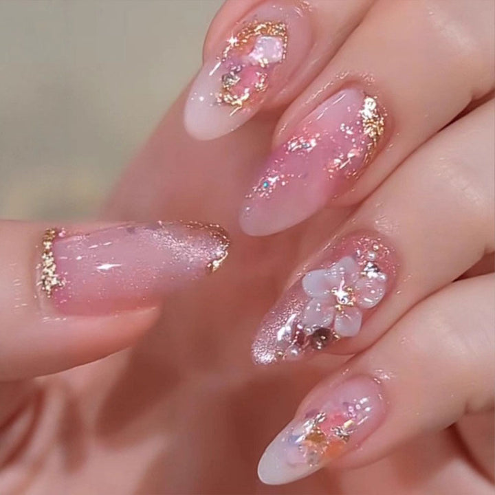 Artificial nails with delicate floral decorations and glitter effects Bowlift