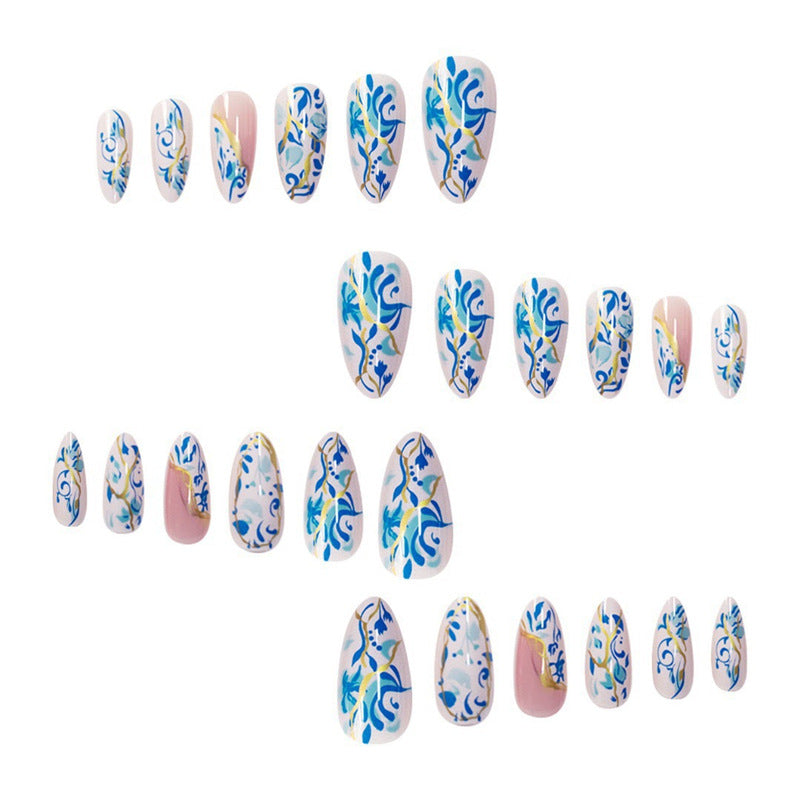 Artistic Floral Press-On Nail Design with Gold Accents Bowlift