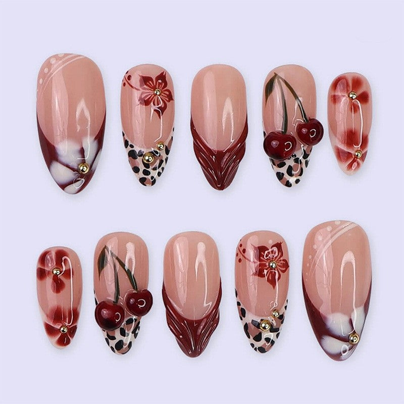 Elegant artificial nails with floral accents and glitter Bowlift