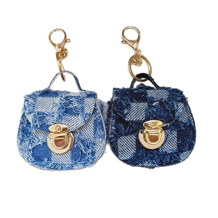 Distressed denim micro crossbody mini purse with gold turn-lock top handle Bowlift
