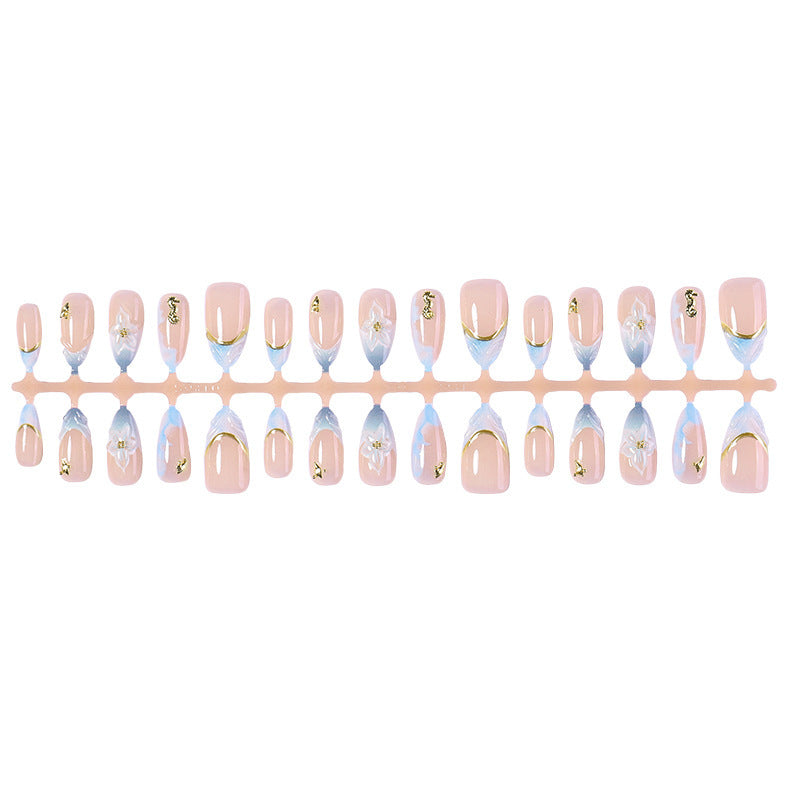 Creative nail set with elegant gold embellishments Bowlift