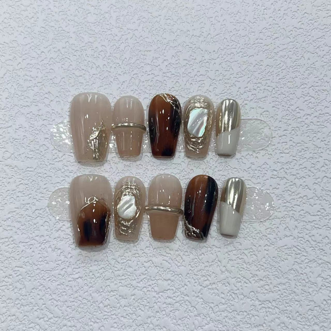 Elegant Nail Art Set with Unique Marble and Metallic Accents Bowlift
