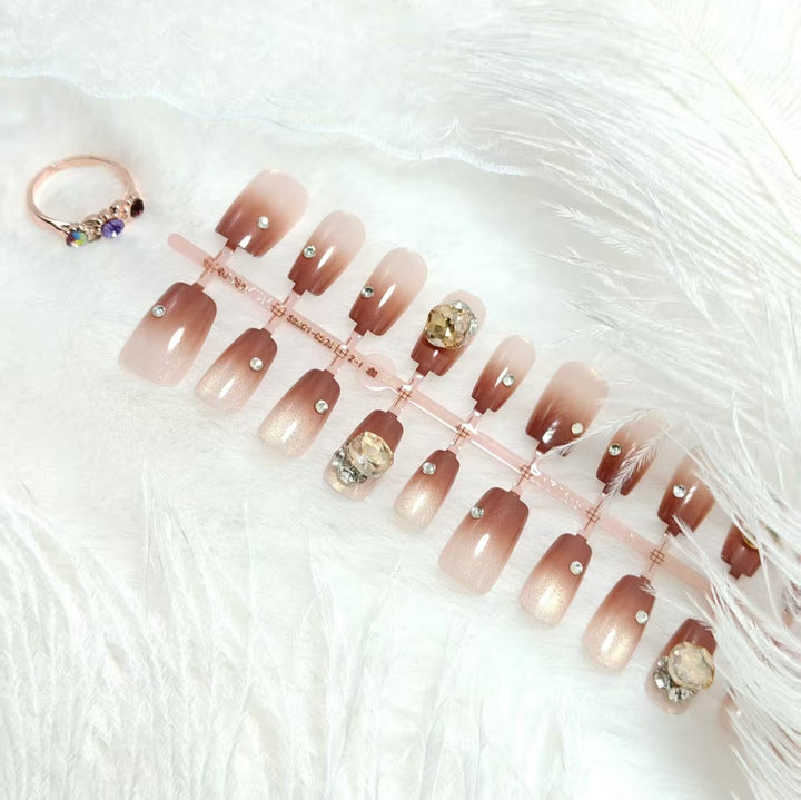 Artificials nails in elegant ombre style with rhinestone embellished applications Bowlift