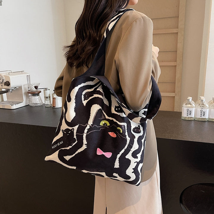 Shoulder bag with playful cat motif Bowlift