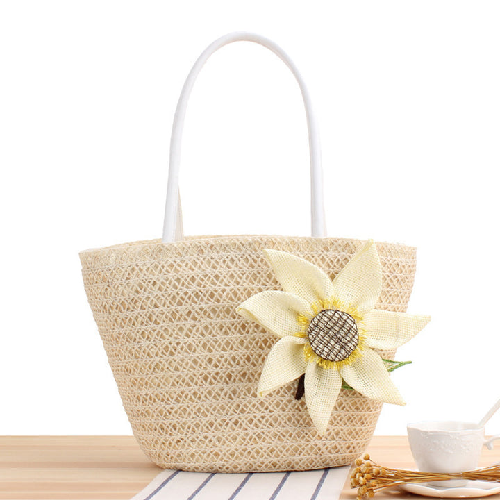 Handbag with floral appliqué Made of natural material Bowlift