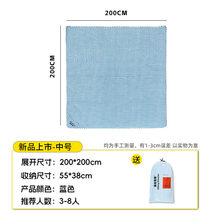 Generous picnic blanket with carry handle and water-repellent underside Bowlift