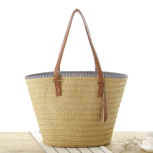 Beach bag made of hand-woven natural material with elegant leather accent Bowlift