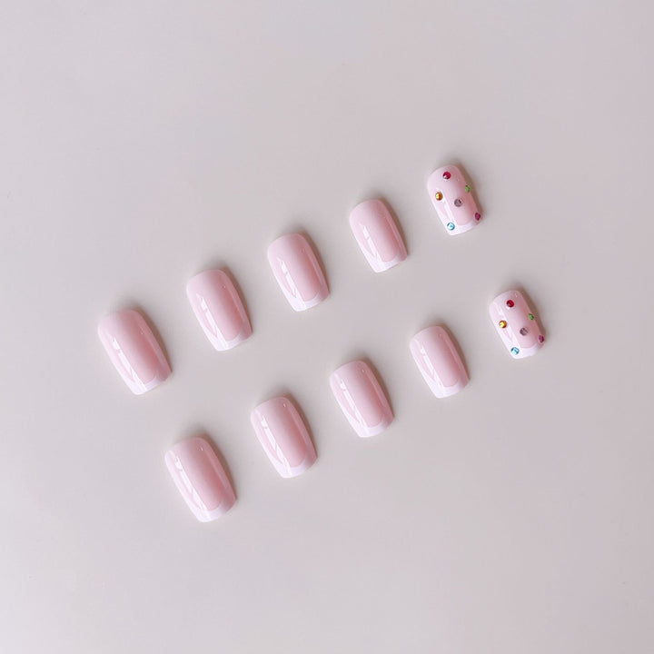Nail art set with elegant French tips and sparkling rhinestone embellishments Bowlift