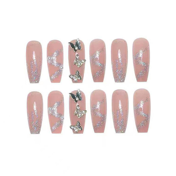 Artificial nails with sparkling rhinestone and bow accents Bowlift