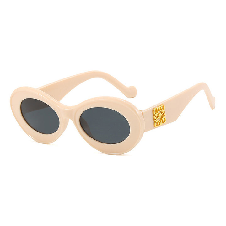 Women's fashionable sunglasses with oval frame and golden accents Bowlift