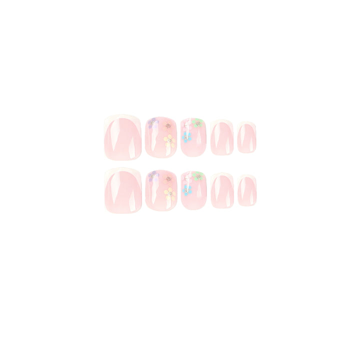 Artistic nail art with floral accent and elegant French tip Bowlift